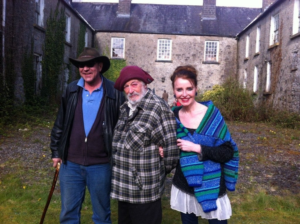 Bob Mitchell, JP Donleavy, and Polly Feversham in the courtyard