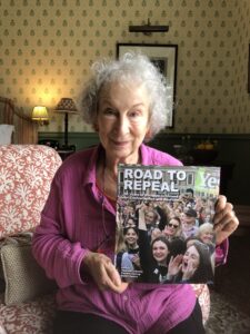 Margaret Atwood with her copy of Road to Repeal